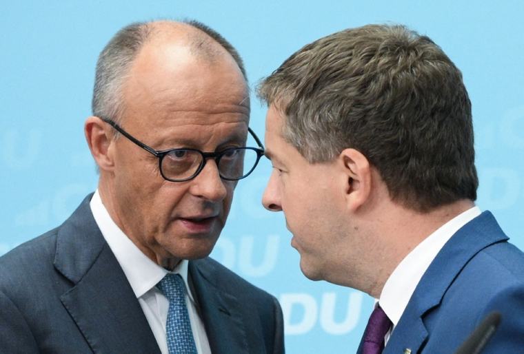 Merz ‘shocked’ by far-right state win but vows to stay course